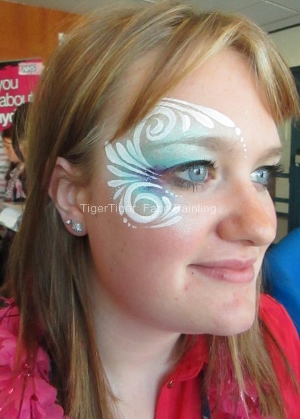 adult face painting swirly eye design