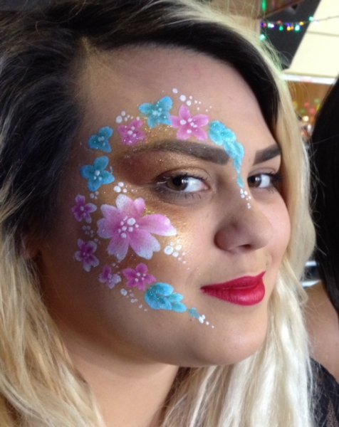 pink and turquoise flowers adult face painting